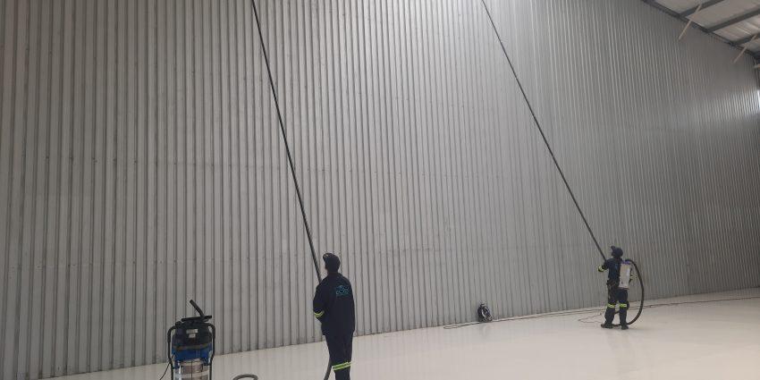 East Coast Industro Services Team Performing High Level Cleaning of a Factory wall safely from the ground